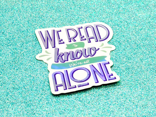 We read to know we're not alone quote holographic bookish vinyl sticker