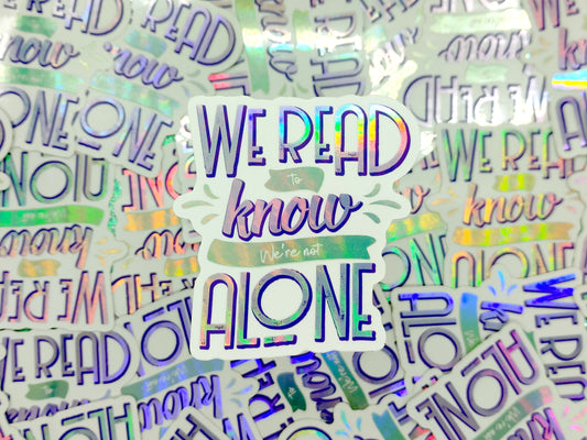 We read to know we're not alone quote holographic bookish vinyl sticker